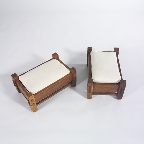 Appraisal: Stickley Brothers pair of foot stools each with loose cushion