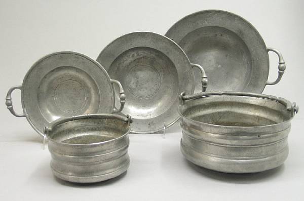 Appraisal: Three Continental pewter graduated two-handled dishes and two small cauldrons