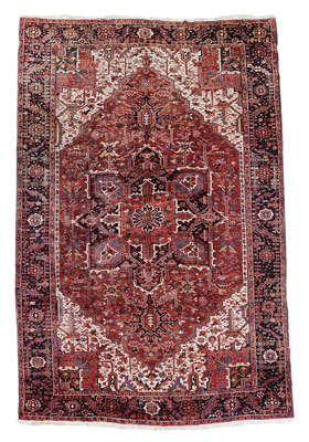 Appraisal: Heriz Rug large brick-red central medallion on ivory ground ft