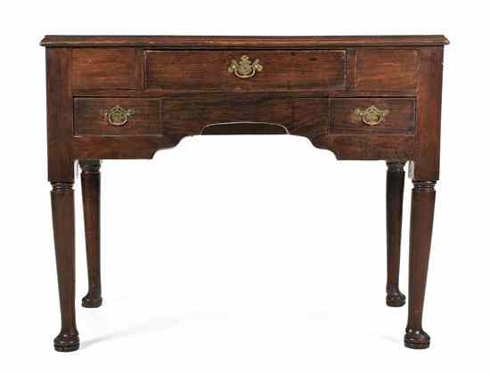 Appraisal: An English Oak Writing Table having a rectangular top over