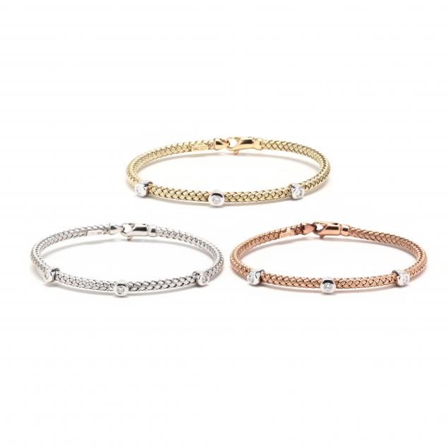 Appraisal: THREE GOLD AND DIAMOND BRACELETS One in each of white