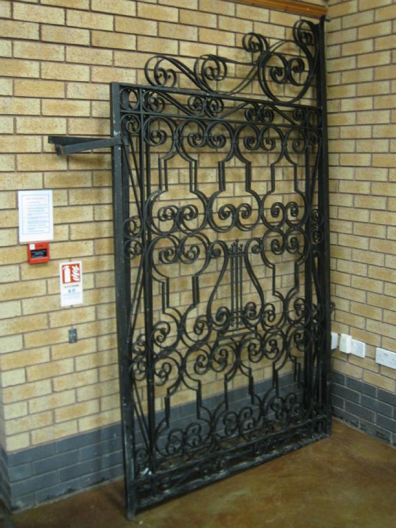 Appraisal: A large pair of wrought iron Gates in W each