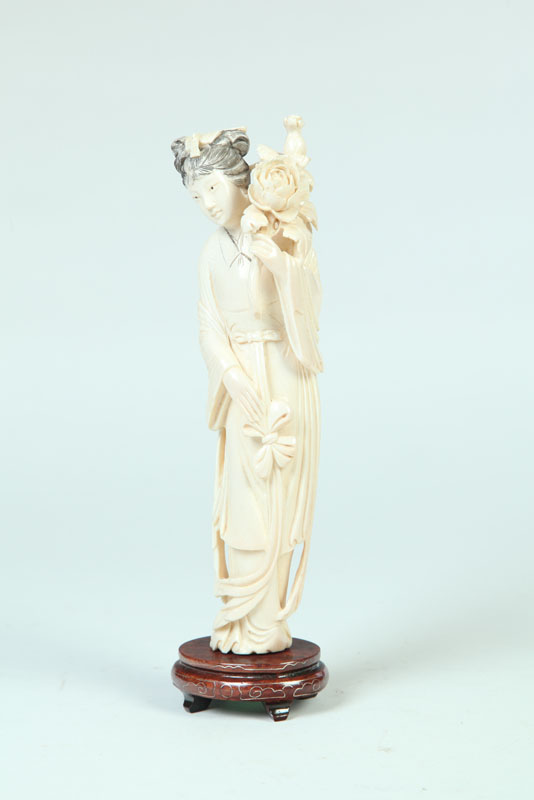 Appraisal: IVORY FIGURE China late th-early th century Carved figure of