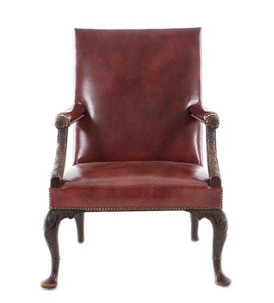 Appraisal: Georgian carved mahogany library armchair circa leather-upholstered back armrests and