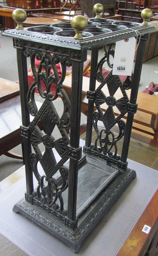 Appraisal: A Victorian black painted cast iron stick stand with brass