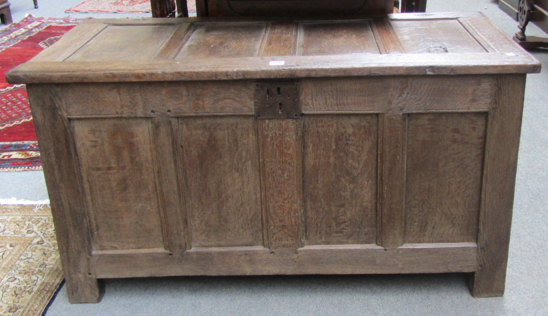 Appraisal: An th century oak coffer with four panel top and