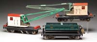 Appraisal: LOT OF THREE LIONEL SERIES FREIGHT CARS Dump car in