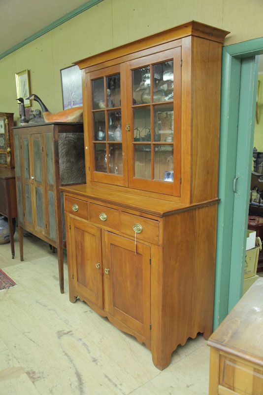 Appraisal: STEPBACK CUPBOARD Cherry having two six panel glazed doors three