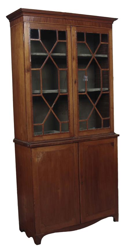 Appraisal: A th century mahogany bookcase cabinet the projected moulded cornice