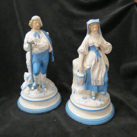 Appraisal: Pair of th Century Porcelain Figurinesof man woman tall farm