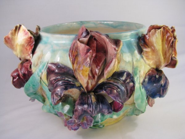 Appraisal: French Majolica jardiniere with floral iris relief in purple yellow