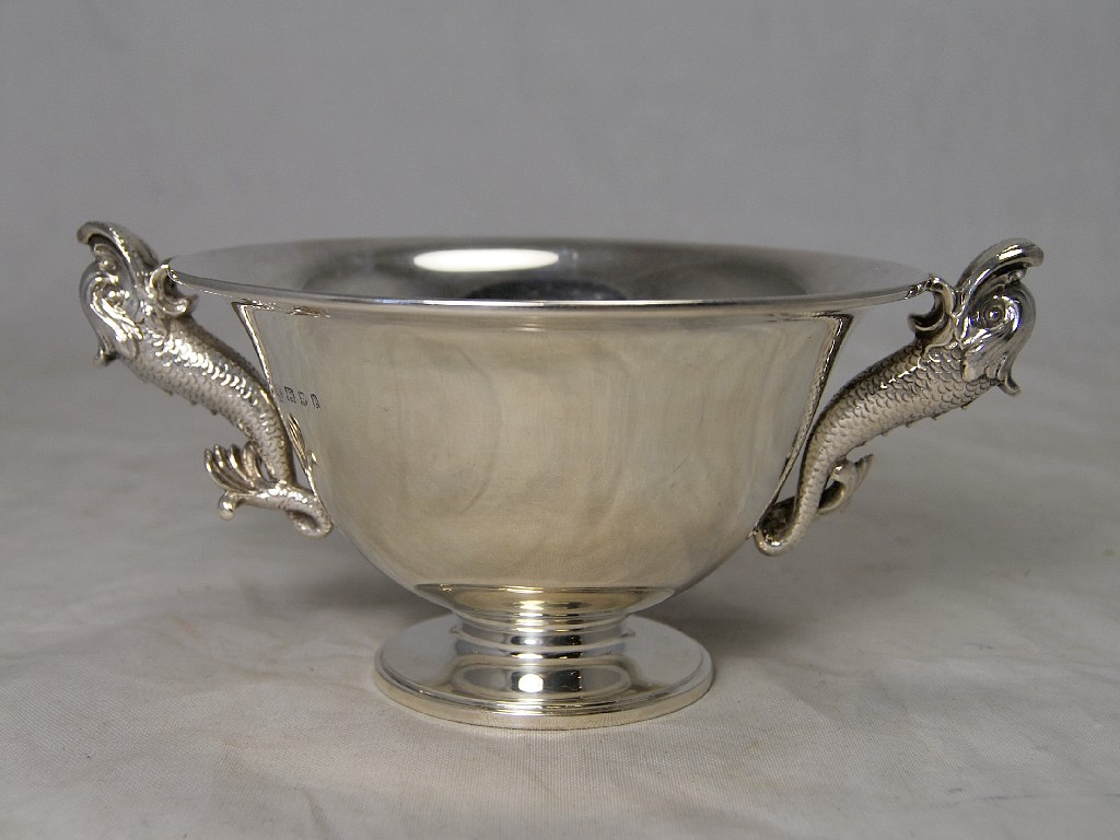 Appraisal: Circular silver bowl on foot having heavily cast and chased