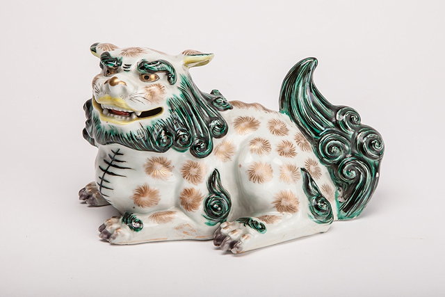 Appraisal: A JAPANESE PORCELAIN RECUMBENT SHI SHI decorated in gilt and