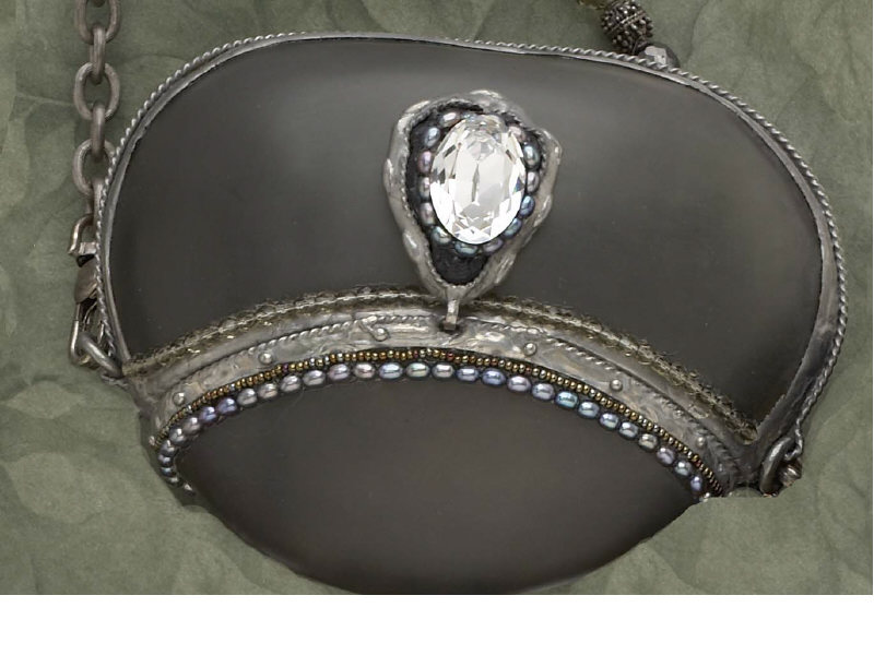 Appraisal: EVENING BAG Molded Lucite bag with pewter fittings and faux