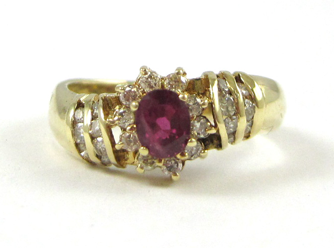 Appraisal: RUBY DIAMOND AND FOURTEEN KARAT GOLD RING with round-cut diamonds