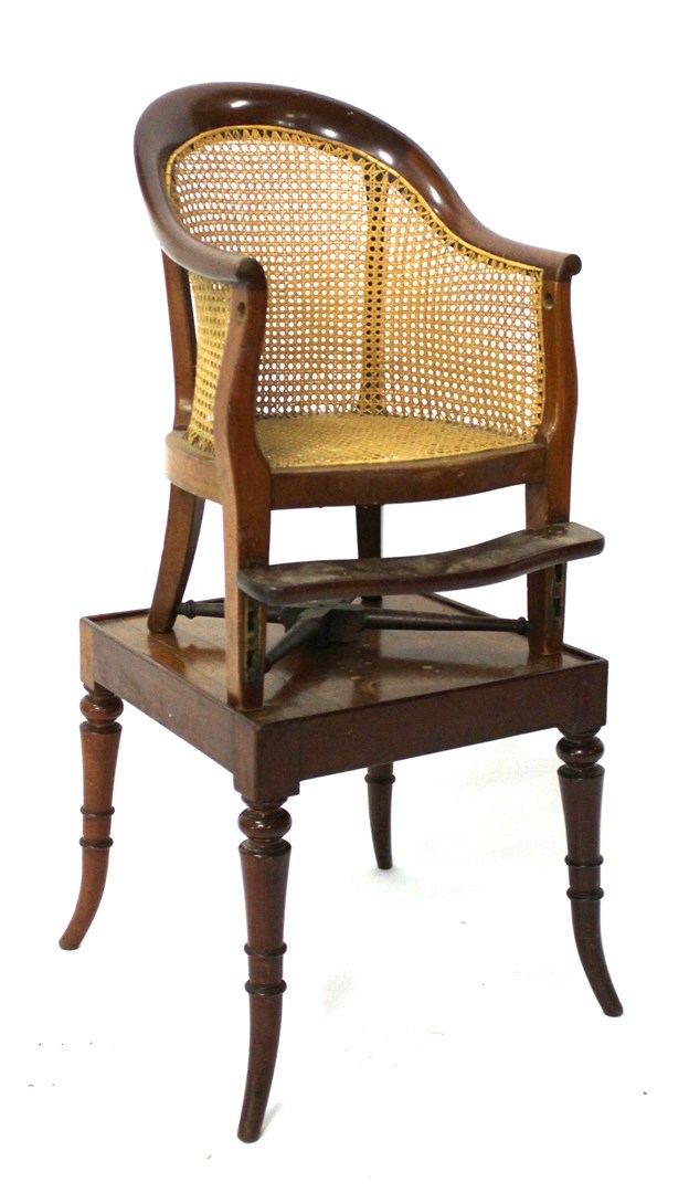 Appraisal: A th century mahogany child's bergere with 'X' frame stretcher