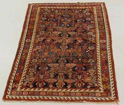 Appraisal: Caucasian oriental center hall carpet ivory border and geometric patterns