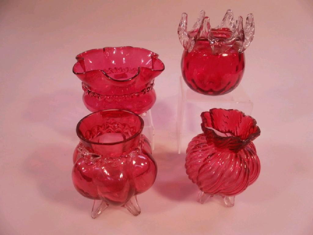 Appraisal: Four Cranberry glass squat vases