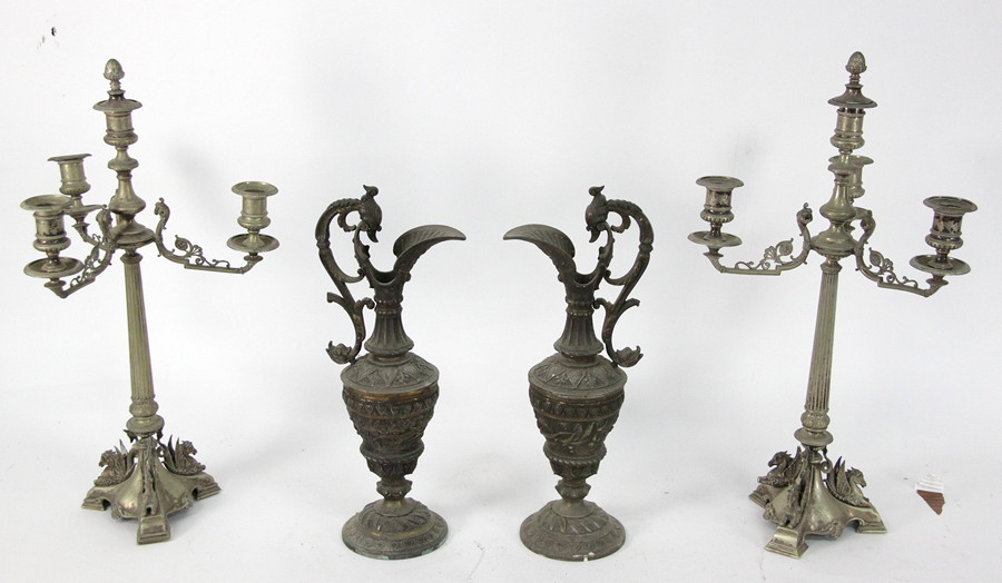 Appraisal: A pair of three-branch four-light candelabra with applied scrolling and