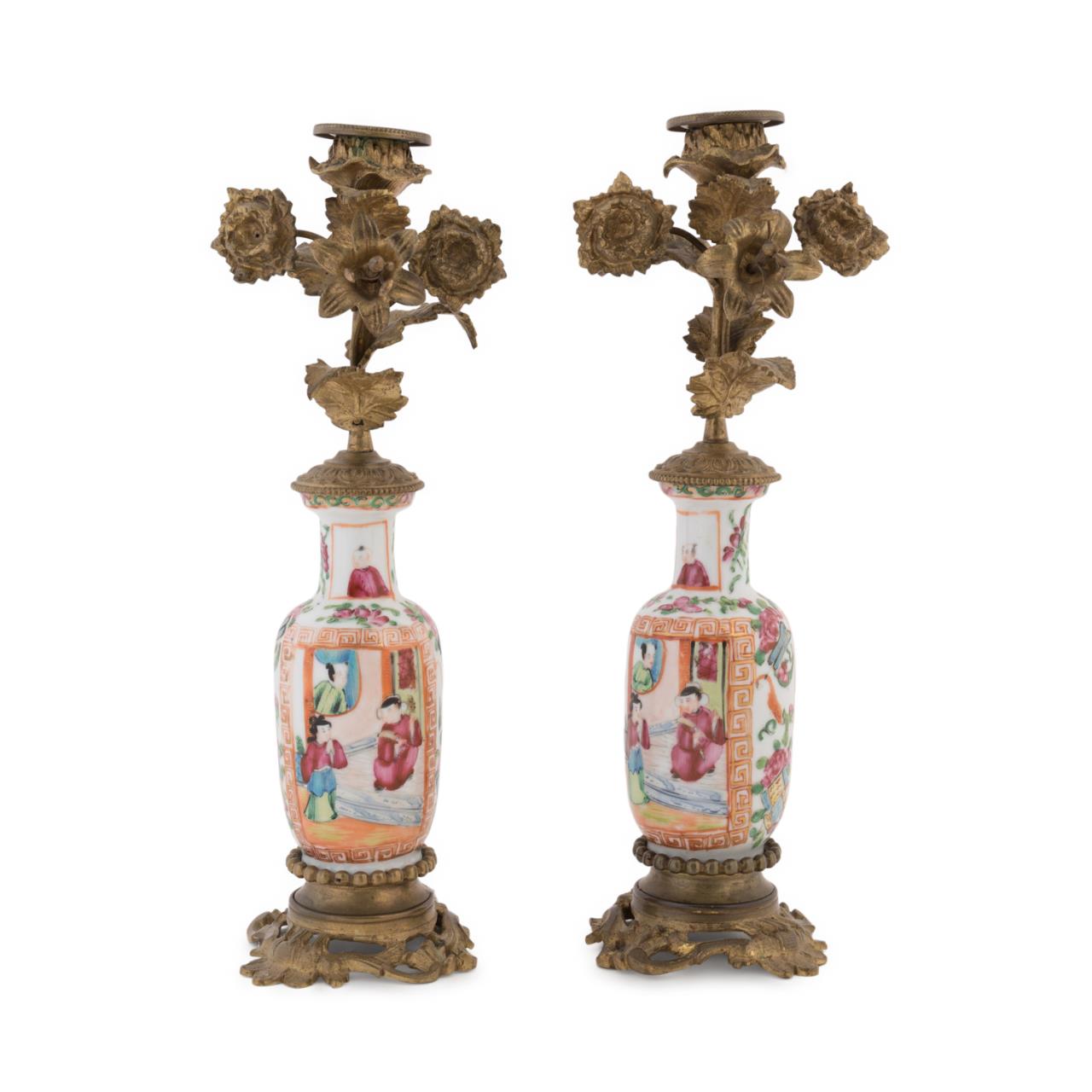 Appraisal: PAIR TH C CHINESE ROSE MANDARIN CANDLESTICKS Pair of Chinese