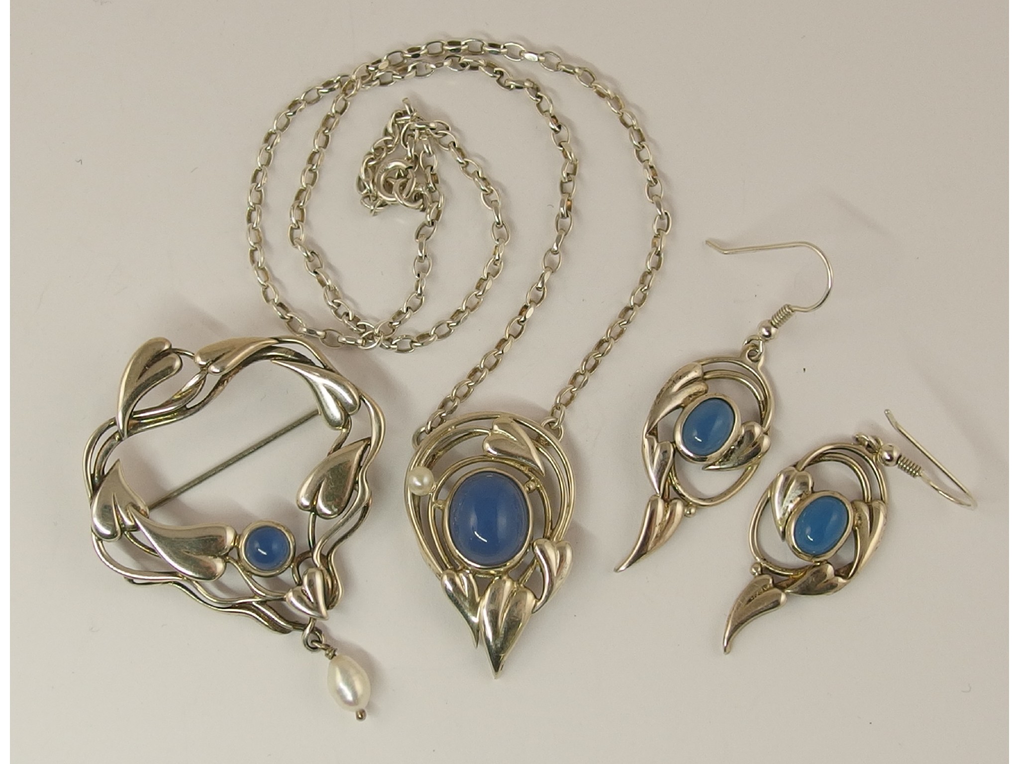 Appraisal: A suite of Arts and Crafts inspired jewellery set with