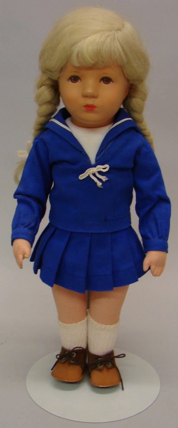 Appraisal: Stofpuppe doll with hard plastic celluloid head and cloth body