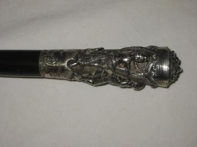 Appraisal: A VICTORIAN WALKING CANE the Burmese silver grip embossed and