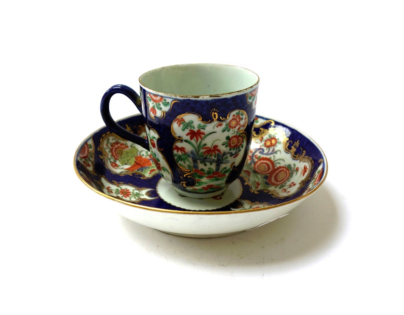 Appraisal: A Worcester coffee cup and saucer circa painted with gilt-