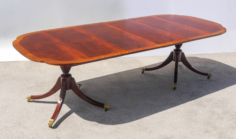 Appraisal: BAKER MAHOGANY DOUBLE PEDESTAL SPLAY LEG DINING TABLE Shaped banded