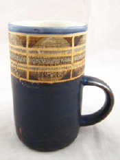 Appraisal: Troika A mug with broad top tan band over dark