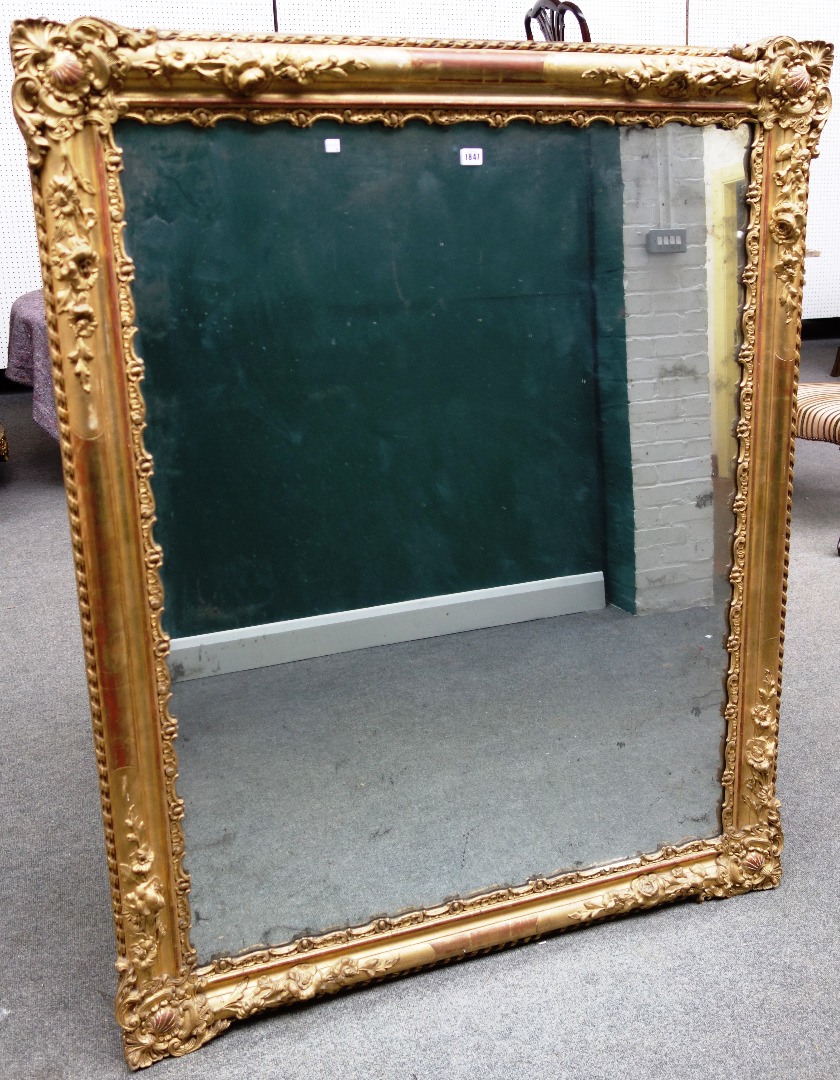 Appraisal: A th century gilt framed rectangular wall mirror with shell