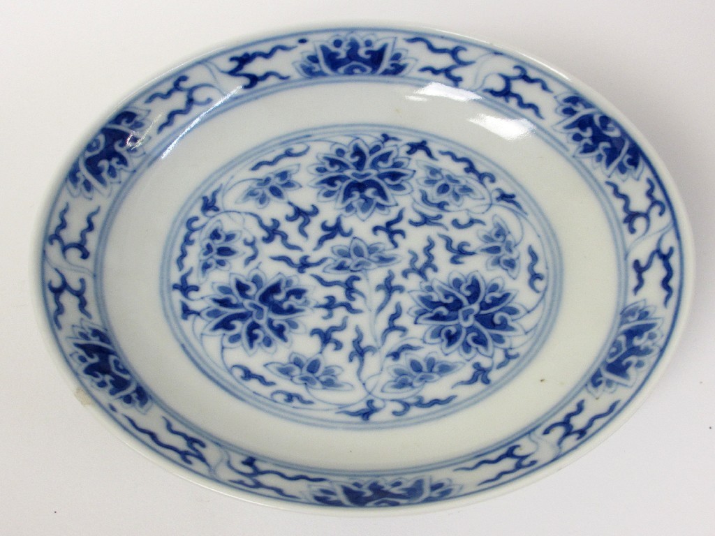 Appraisal: A Chinese blue and white saucer painted with peonies and