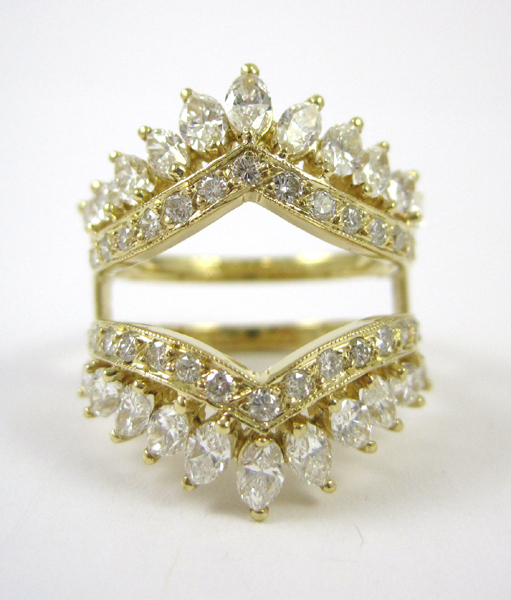 Appraisal: DIAMOND AND FOURTEEN KARAT GOLD RING JACKET set with marquise-cut