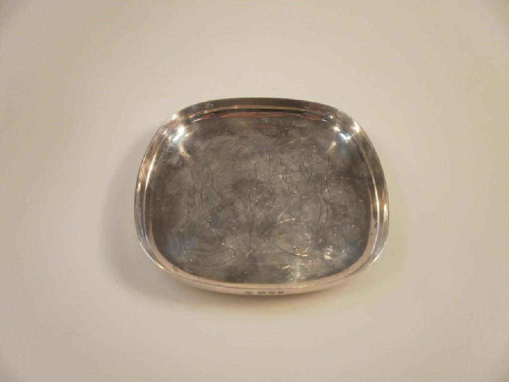 Appraisal: A silver ash tray with engraved image depicting Adam and