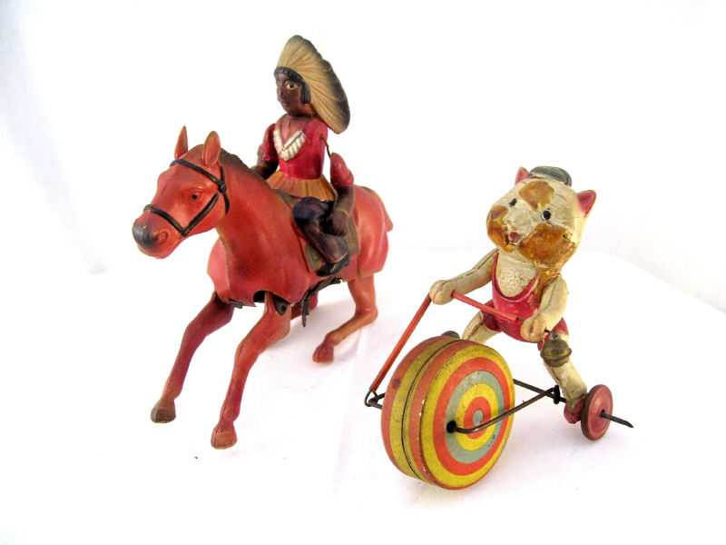 Appraisal: Celluloid Windup Figures Includes Cat with wheel residue on cats