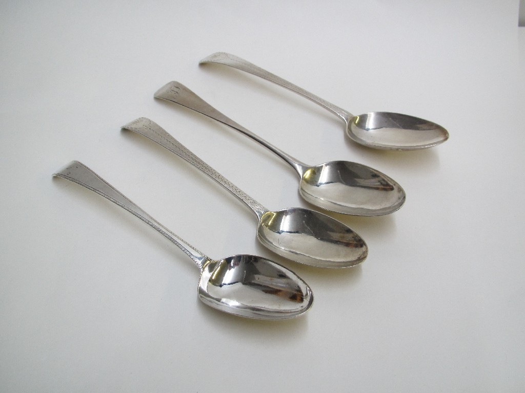 Appraisal: A pair of bright cut George III silver soup spoons