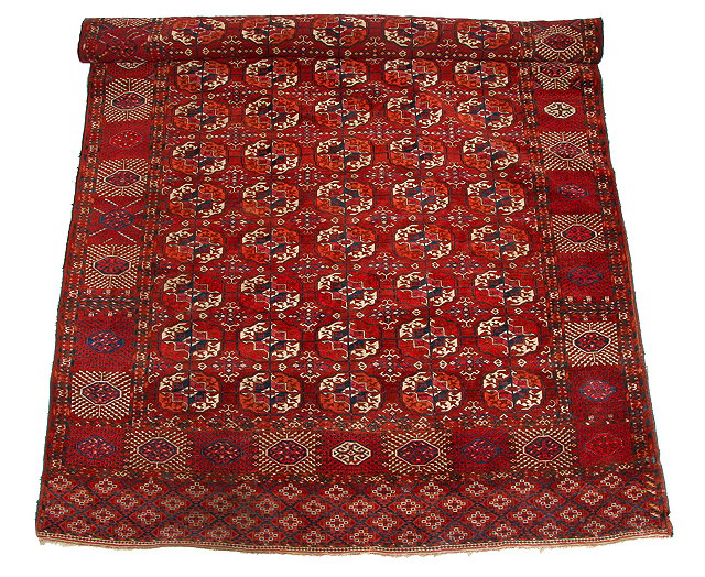 Appraisal: A BELOUCH RED GROUND LARGE RUG with central geometric decoration