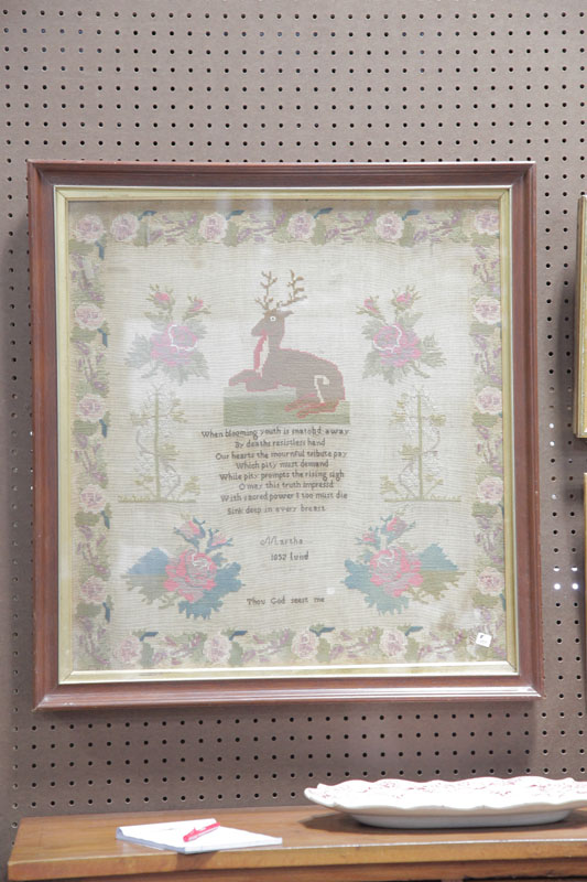 Appraisal: FRAMED SAMPLER Depicting a stag in repose surrounded by various