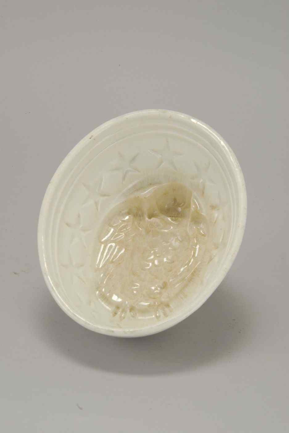 Appraisal: WHITE CERAMIC MOLD th CenturyWith eagle center surrounded by twelve