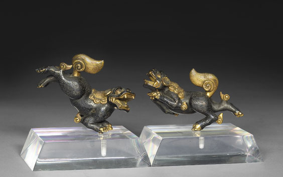 Appraisal: PAIR ANTIQUE BRONZE QILIN ORNAMENTS Pair of rare antique Chinese