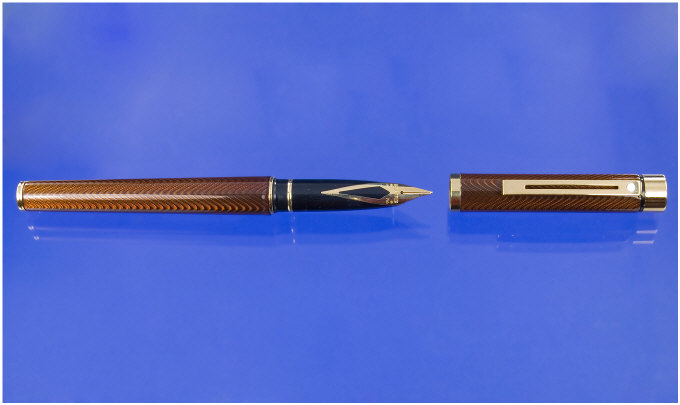 Appraisal: Sheaffer A Sheaffer Targa amber laque over an engine turned