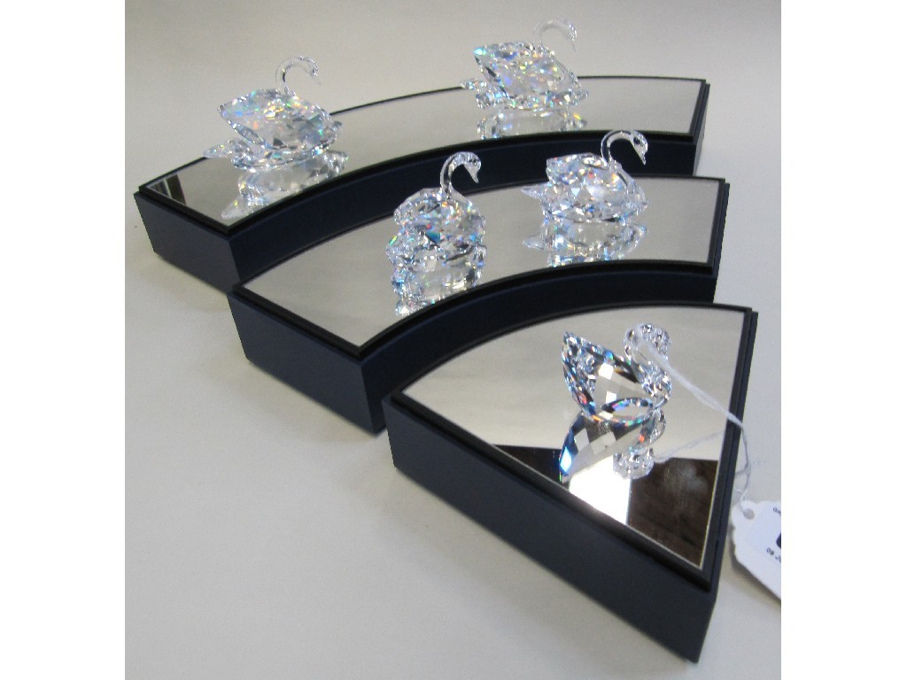 Appraisal: Five Swarovski crystal figures of swans and three section crystal