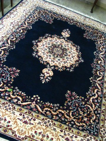 Appraisal: India Kerman rug approximately x navy field with floral motif