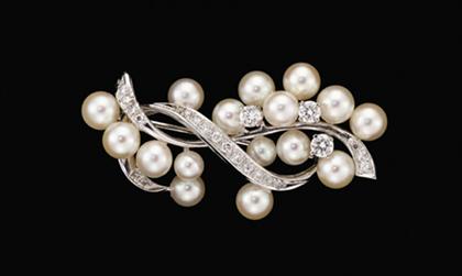 Appraisal: karat white gold pearl and diamond brooch Fifteen white luster