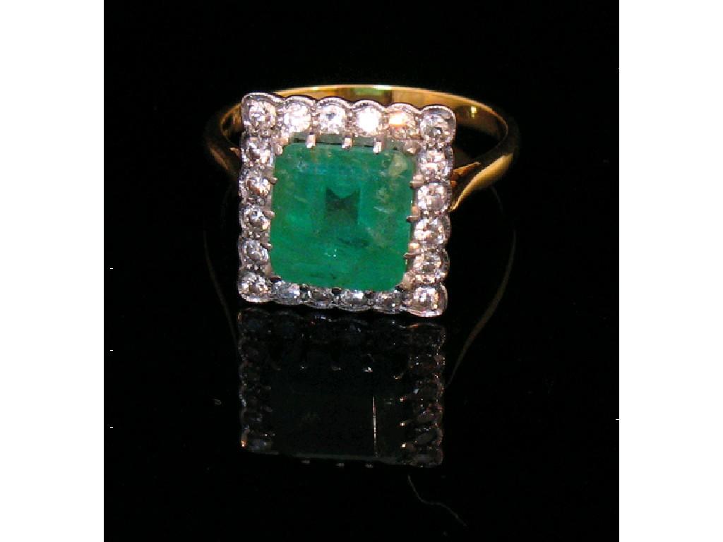 Appraisal: AN EMERALD AND DIAMOND CLUSTER DRESS RING the large central