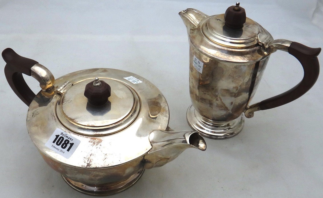 Appraisal: A silver teapot of panelled circular form Sheffield and a