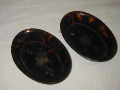 Appraisal: A PAIR OF TORTOISESHELL AND PIQUE PIN TRAYS of oval