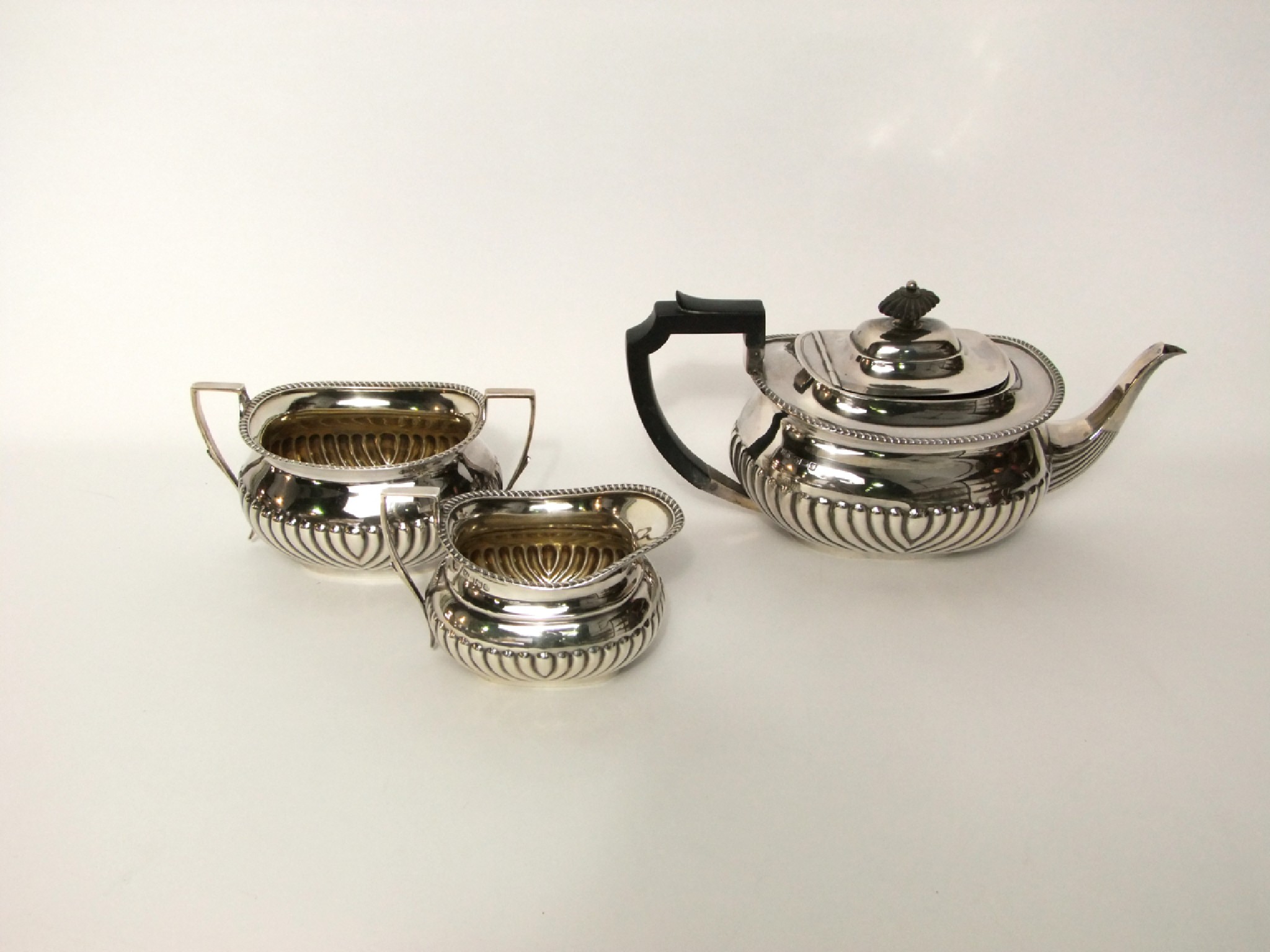 Appraisal: An assembled three-piece tea set Atkin Brothers Sheffield comprising a