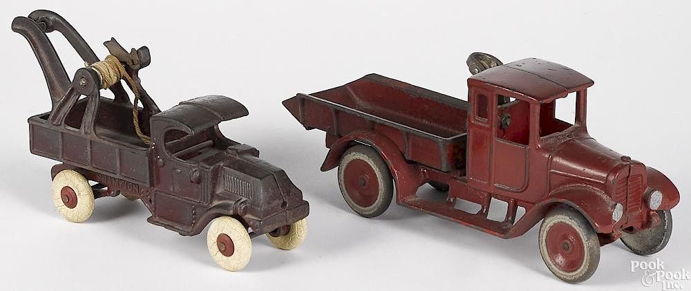 Appraisal: Two cast iron trucks Two cast iron trucks to include