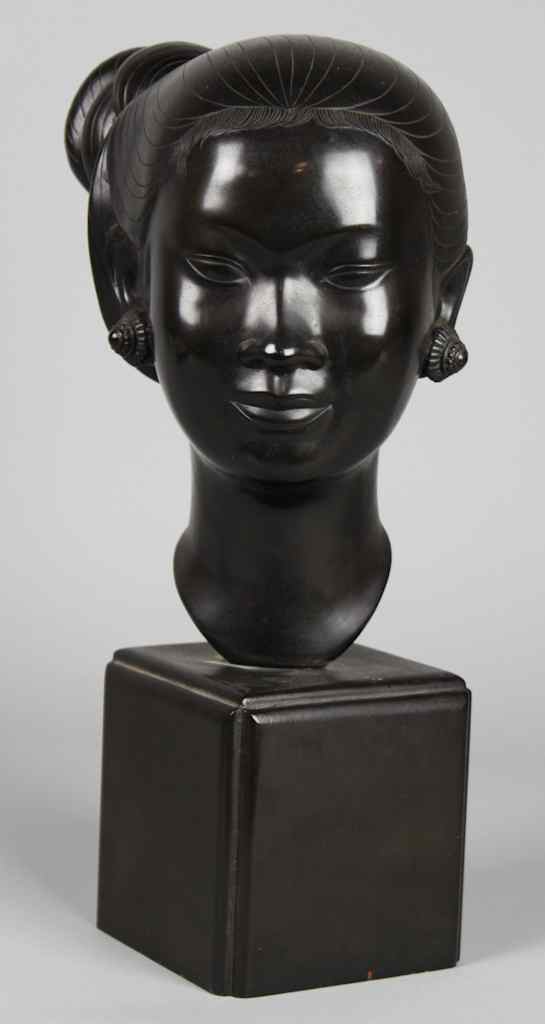 Appraisal: PORTRAIT BUST OF AN ASIAN LADY the patinated lady with